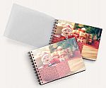 75% Off 2+ Photo Books: 4"x6" or 4"x4" Photo PrintBook 2 for $3.50 